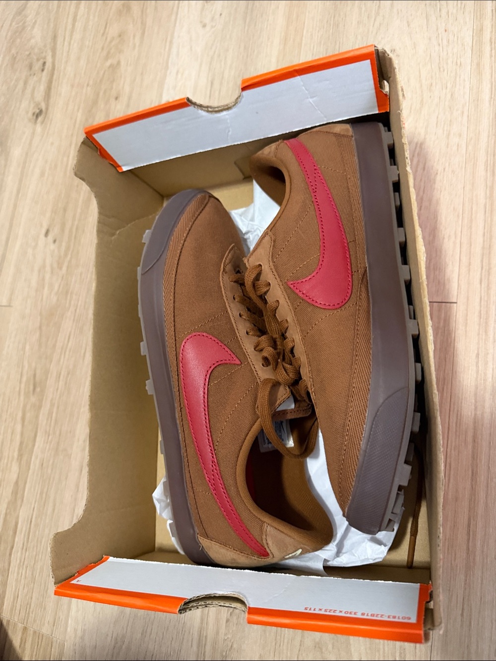 Nike Men's Low-Top Sneaker in Brown with Red Swoosh
